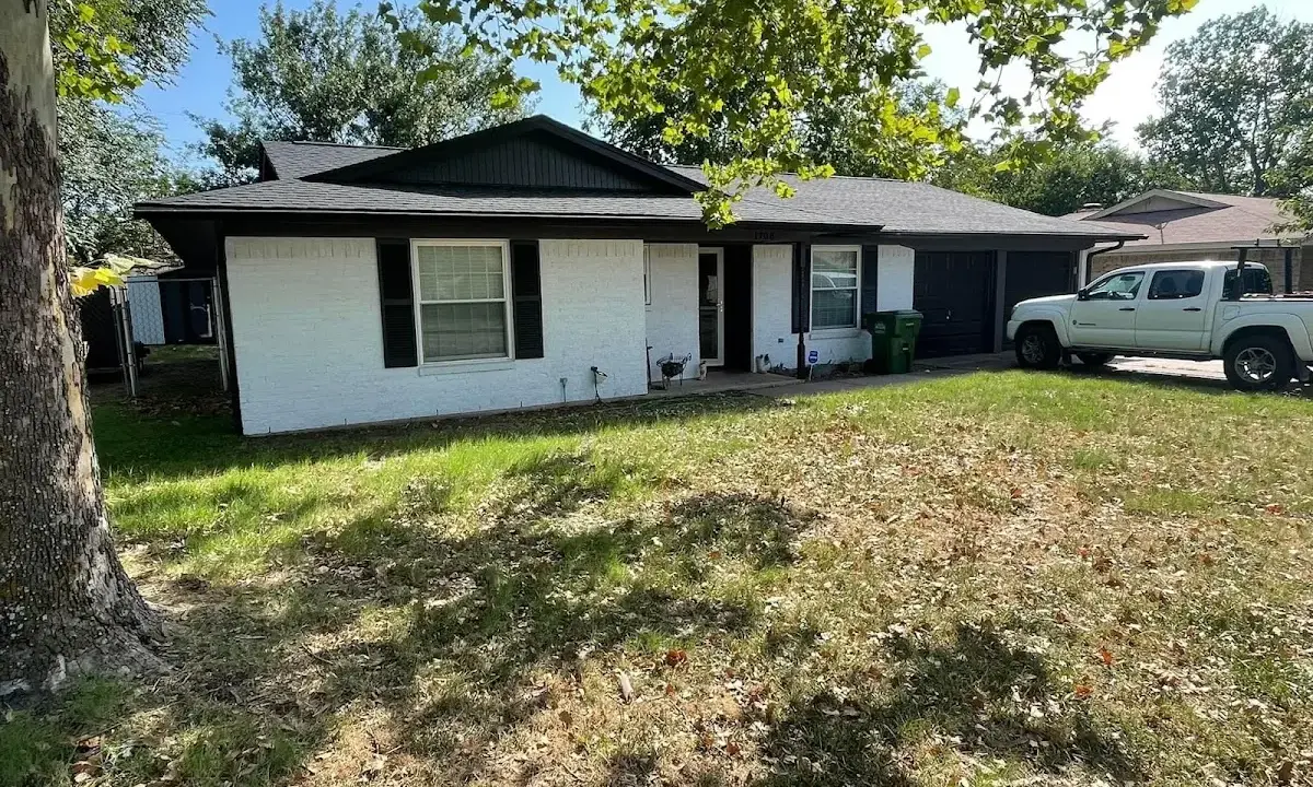 Professional roofing crew working on a residential roof in Readington